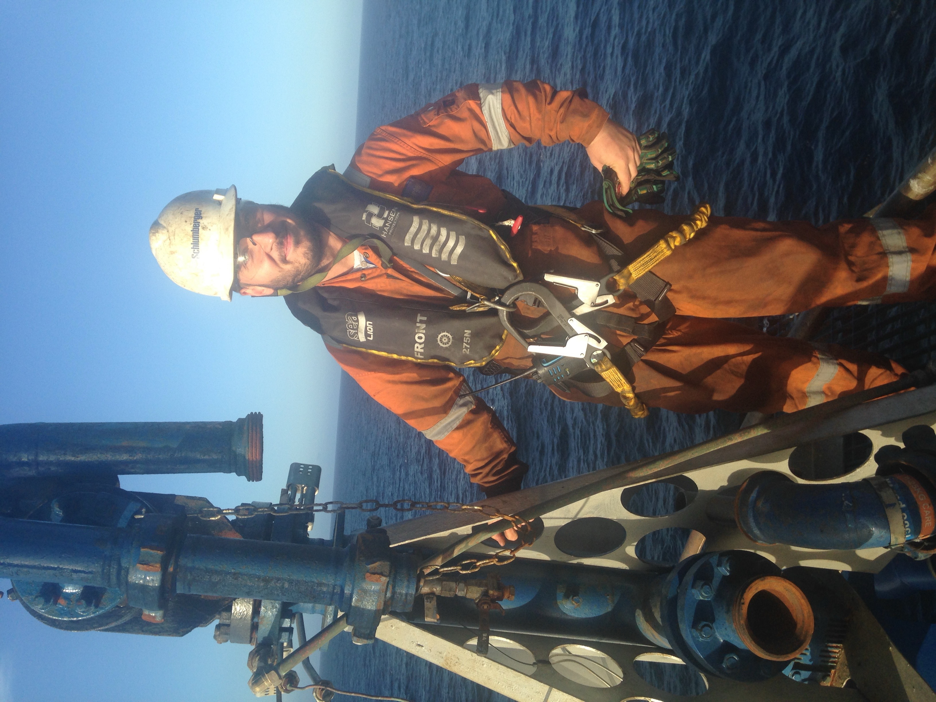 Alexandru Stan working offshore in PPE and fall-protection equipment.
