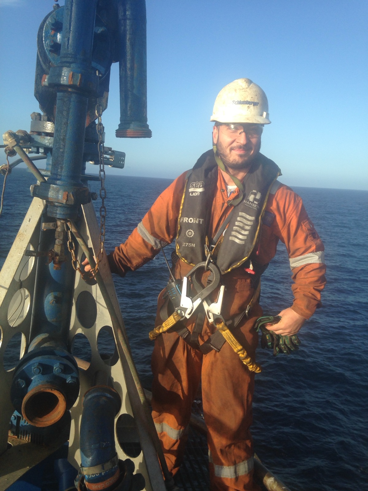 Alexandru Stan working offshore in PPE and fall-protection equipment.